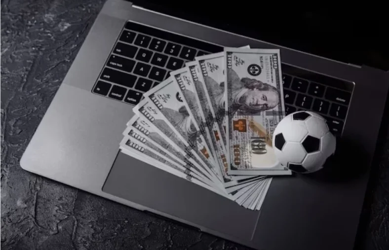 Conceito de apostas e ganhar dinheiro online. jogos de desporto